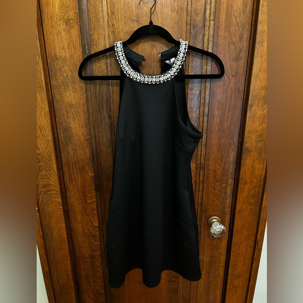 Black dress with detailed neckline of pearls and crystals.